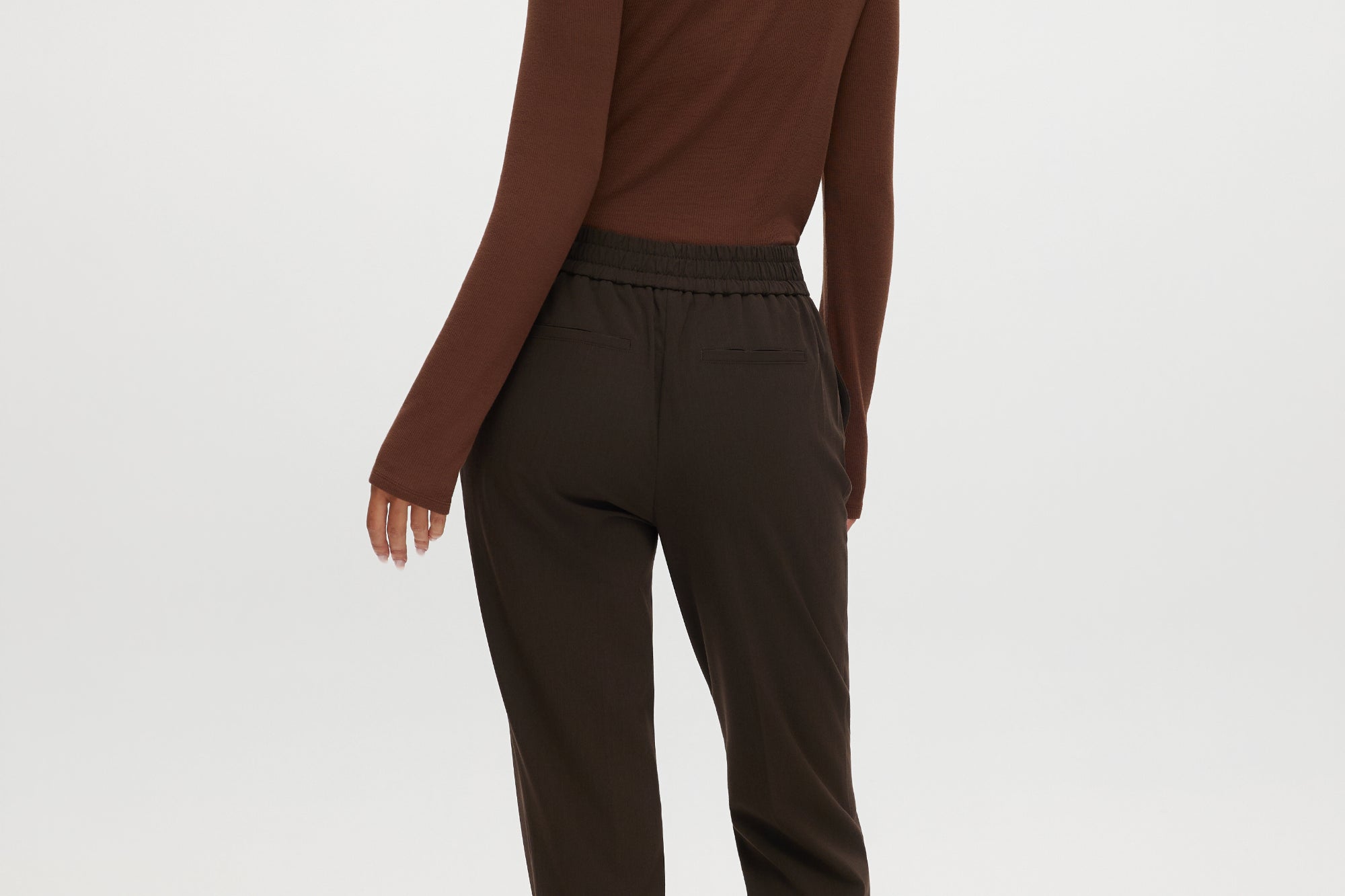 Heather Chocolate Skinny Leg Pull-On Pant featuring an elastic waistband and pockets by Hilary Radley.