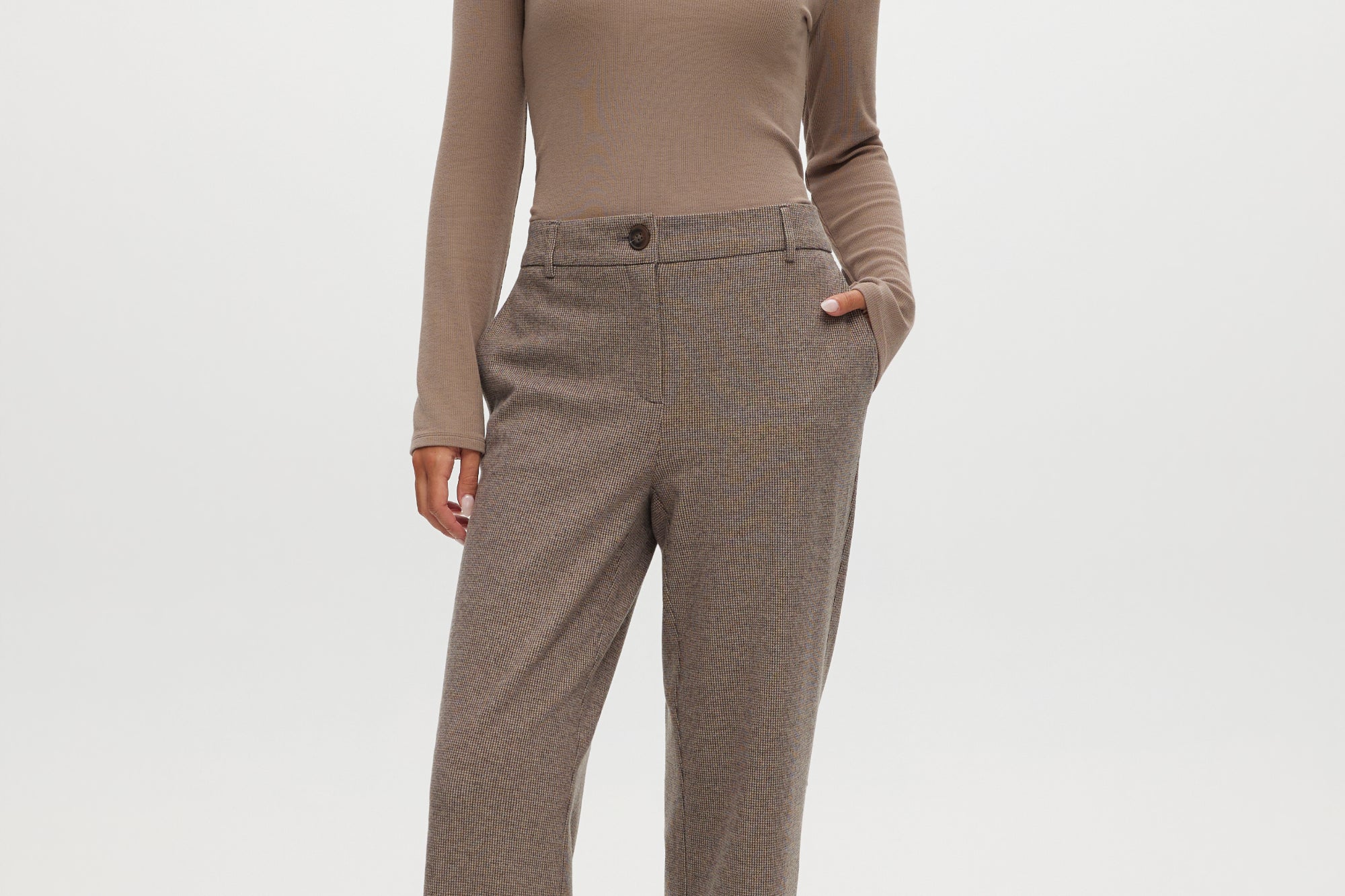Brown herringbone straight leg pants with textured knit and pockets.