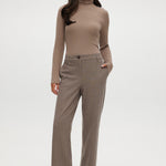 Brown herringbone straight leg pants with textured knit and pockets.