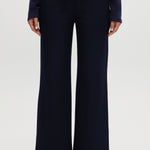 Navy pull-on straight leg pants featuring an elastic waistband and side pockets by Hilary Radley.