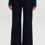 Navy pull-on straight leg pants featuring an elastic waistband and side pockets by Hilary Radley.