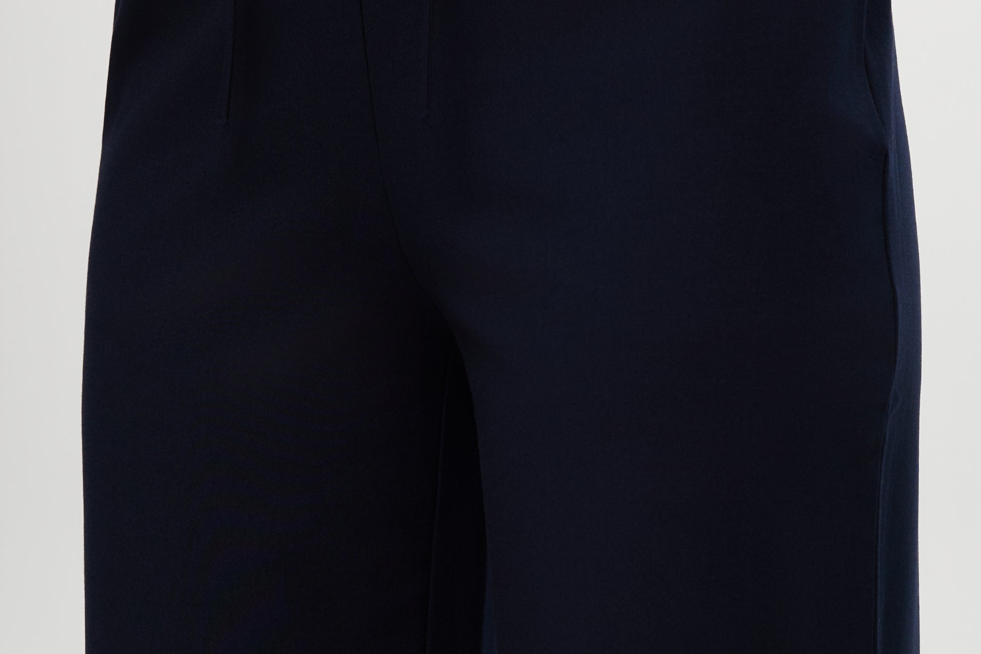 Navy pull-on straight leg pants featuring an elastic waistband and side pockets by Hilary Radley.