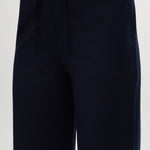 Navy pull-on straight leg pants featuring an elastic waistband and side pockets by Hilary Radley.