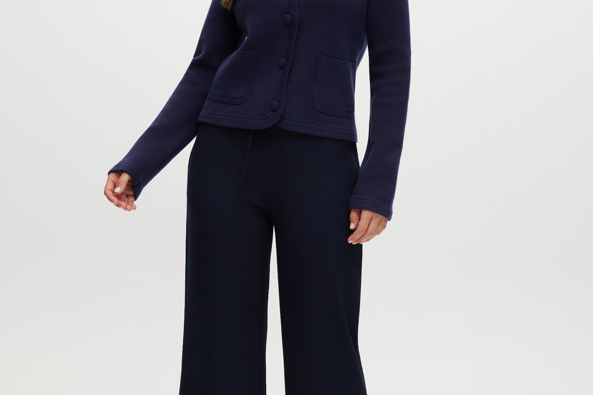 Navy pull-on straight leg pants with elastic waistband and side pockets.