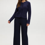 Navy pull-on straight leg pants with elastic waistband and side pockets.