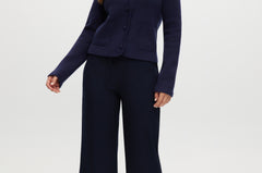 Navy pull-on straight leg pants with elastic waistband and side pockets.