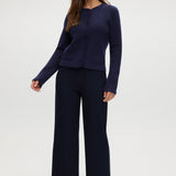 Navy pull-on straight leg pants with elastic waistband and side pockets.