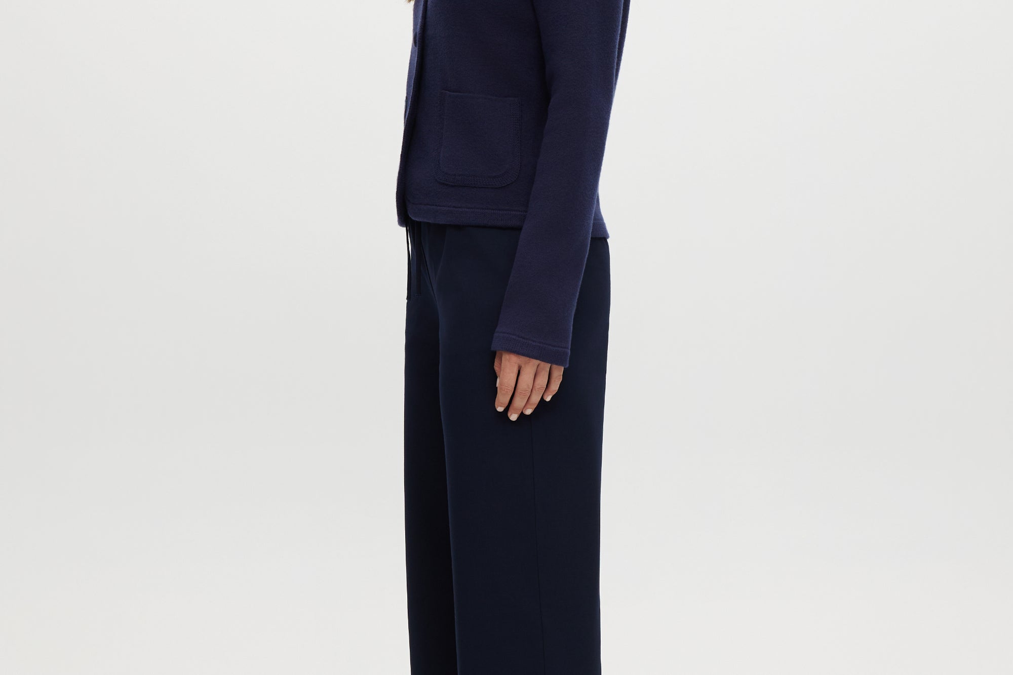 Navy pull-on straight leg pants featuring an elastic waistband and side pockets by Hilary Radley.