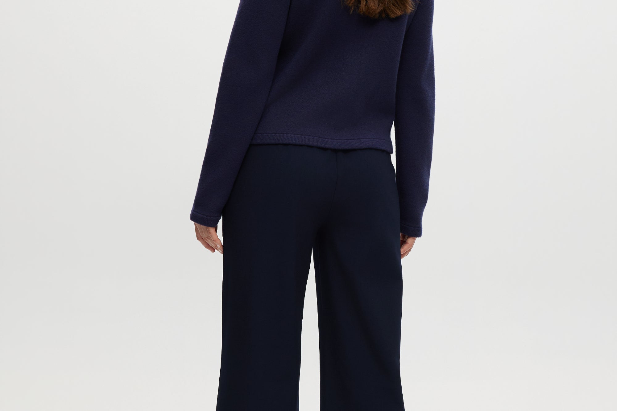 Navy pull-on straight leg pants featuring an elastic waistband and side pockets by Hilary Radley.
