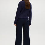 Navy pull-on straight leg pants featuring an elastic waistband and side pockets by Hilary Radley.