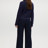Navy pull-on straight leg pants featuring an elastic waistband and side pockets by Hilary Radley.