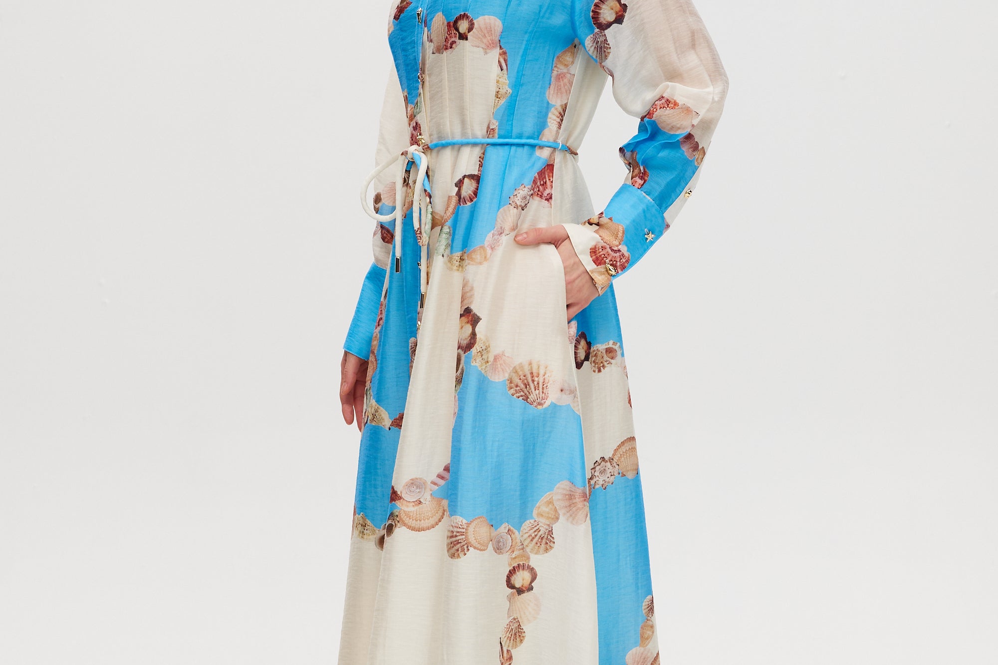 Azure Floral Printed Linen Blend Maxi Dress featuring a classic collar, long sleeves, button-front design, and adjustable waist by Hilary Radley.
