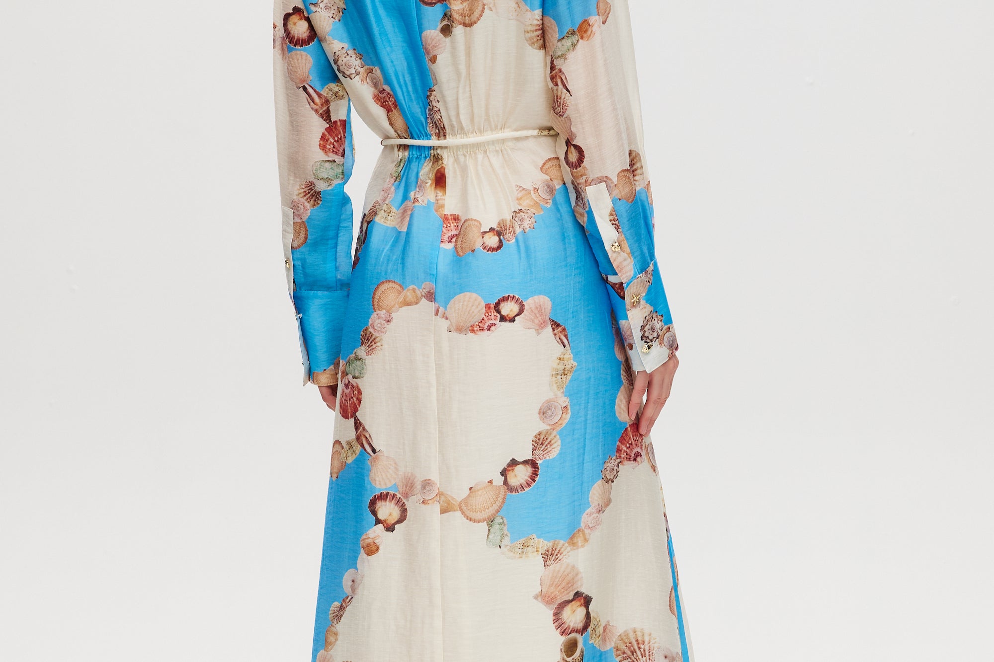 Azure Floral Printed Linen Blend Maxi Dress featuring a classic collar, long sleeves, button-front, and adjustable waist by Hilary Radley.