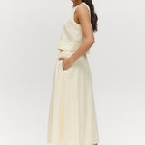 Yellow linen blend pull-on pleated midi skirt featuring pockets and an elastic waistband by Hilary Radley.