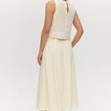 Yellow linen blend pull-on pleated midi skirt featuring pockets and an elastic waistband by Hilary Radley.