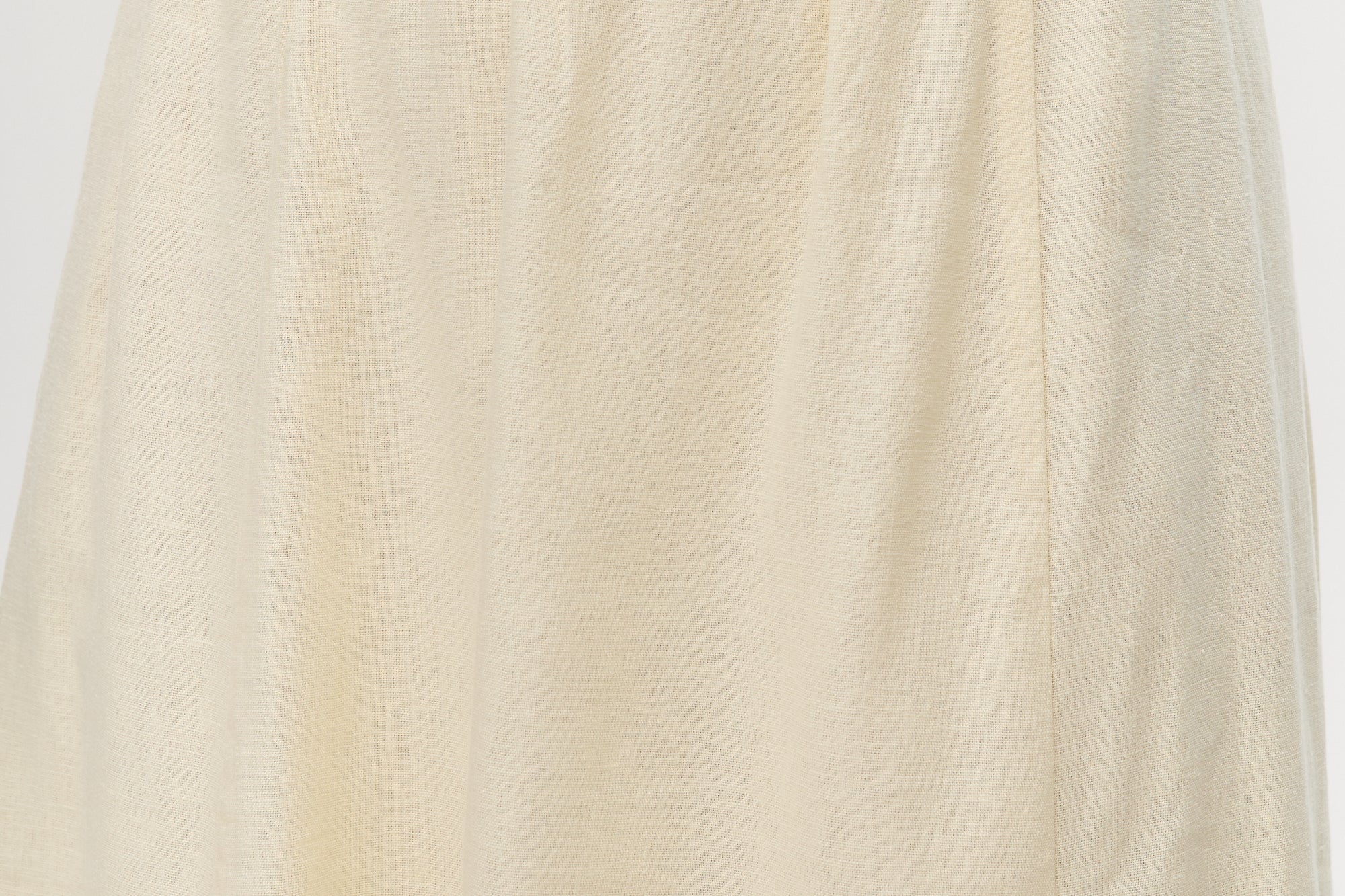 Yellow pleated linen blend midi skirt featuring pockets and an elastic waistband by Hilary Radley.