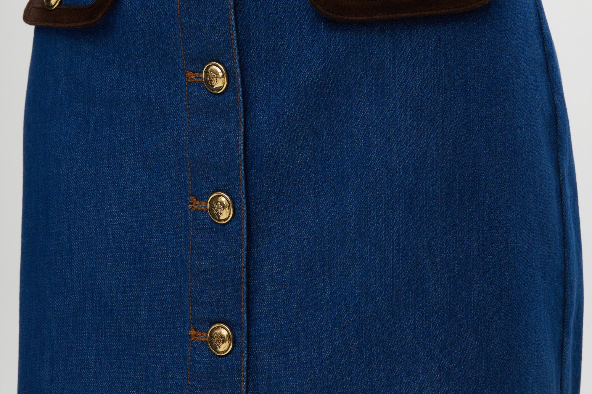 Blue Contrast Trim Denim Mini Skirt featuring vegan leather trim and gold buttons by Hilary Radley.
