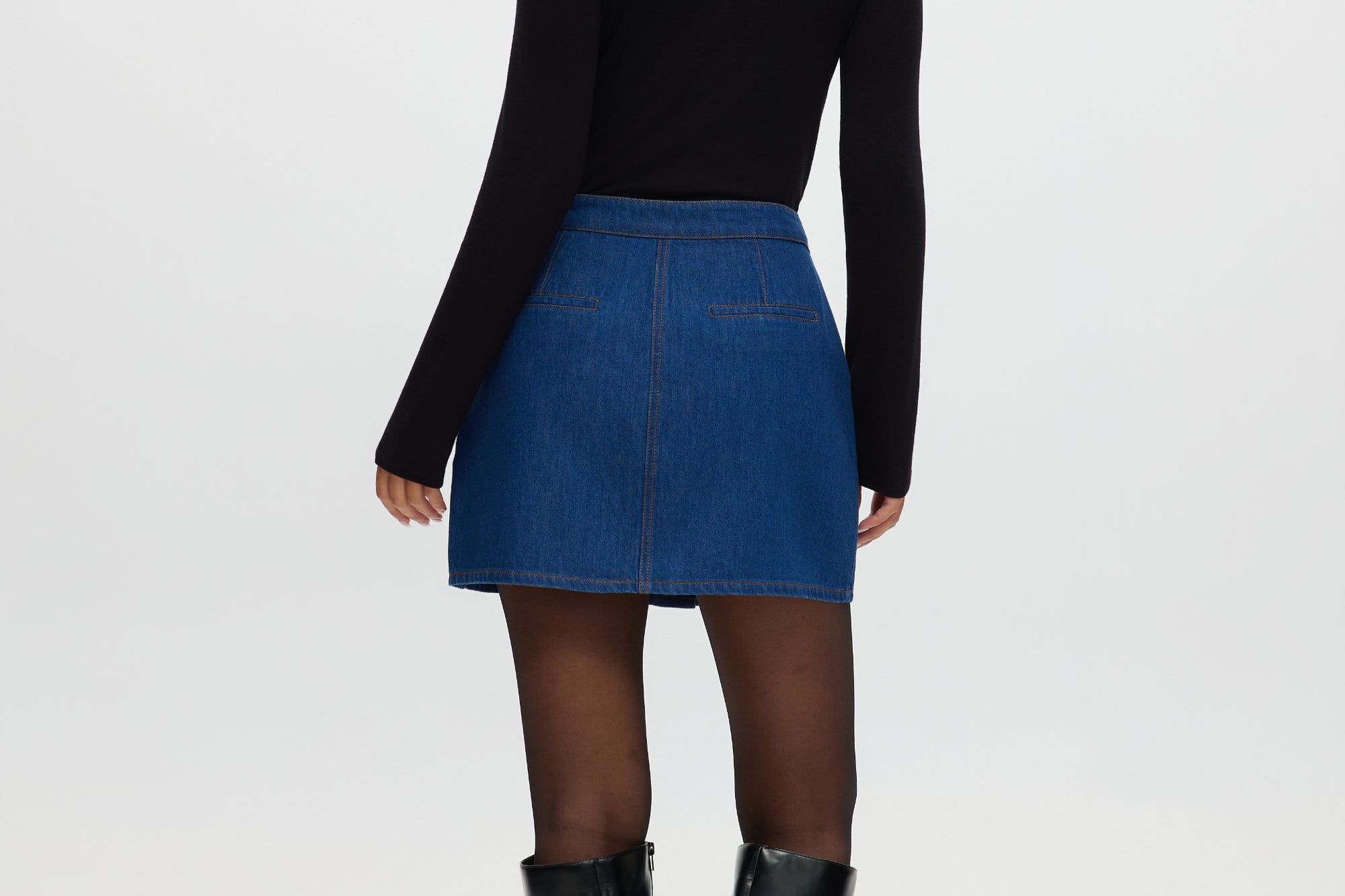 Blue Contrast Trim Denim Mini Skirt featuring vegan leather trim and gold buttons by Hilary Radley.