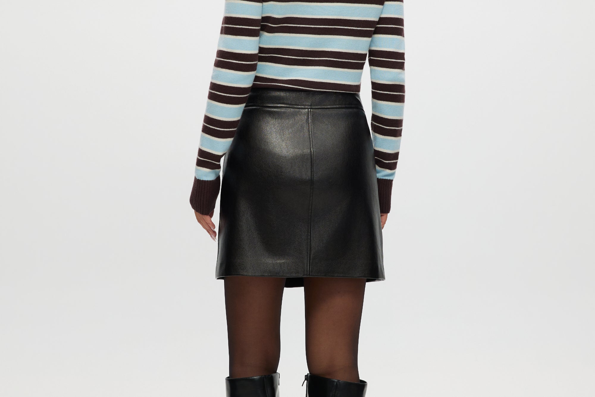 Black vegan leather A-line skirt featuring a high waist and comfort waistband by Hilary Radley.