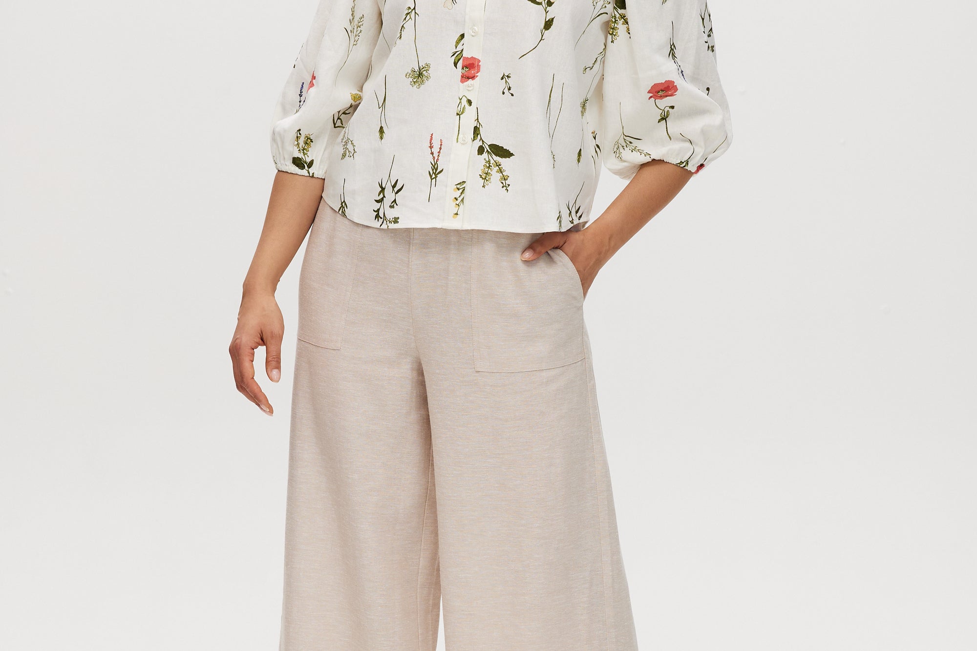 Ivory floral linen blend blouse featuring 3/4 sleeves and button-front closure by Hilary Radley.