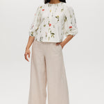 Ivory floral linen blend blouse featuring 3/4 sleeves and button-front closure by Hilary Radley.
