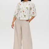 Ivory floral linen blend blouse featuring 3/4 sleeves and button-front closure by Hilary Radley.
