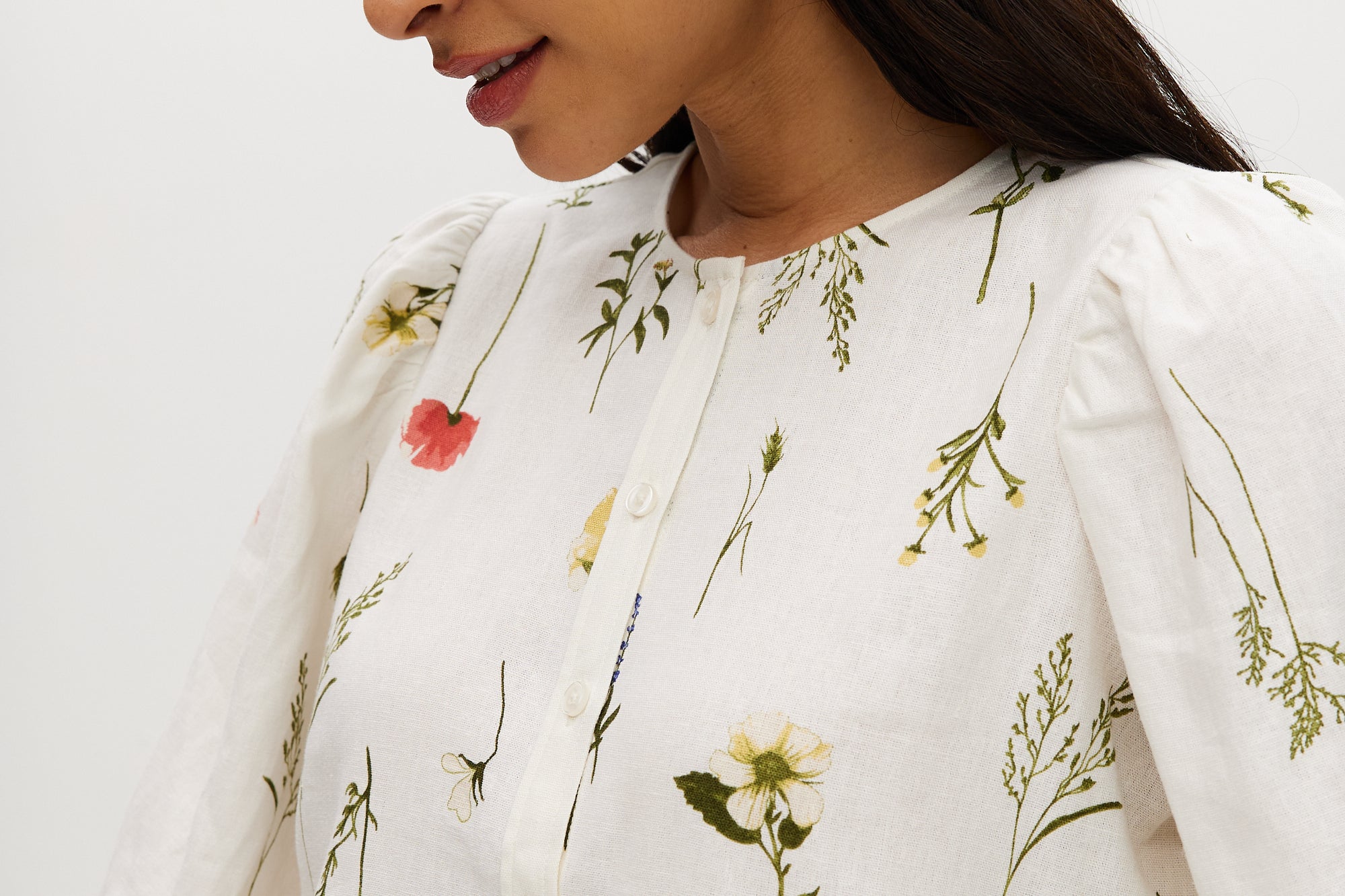 Ivory floral linen blend blouse featuring 3/4 sleeves and button-front closure by Hilary Radley.