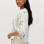 Ivory floral linen blend blouse featuring 3/4 sleeves and button-front closure by Hilary Radley.