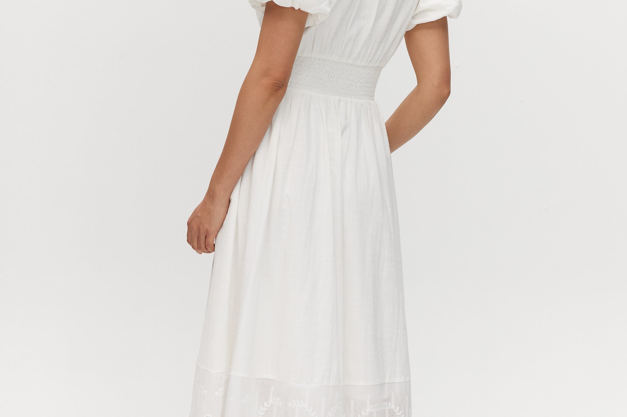 White Lace Hem Maxi Dress featuring a V-neckline and short balloon sleeves, available from Hilary Radley.