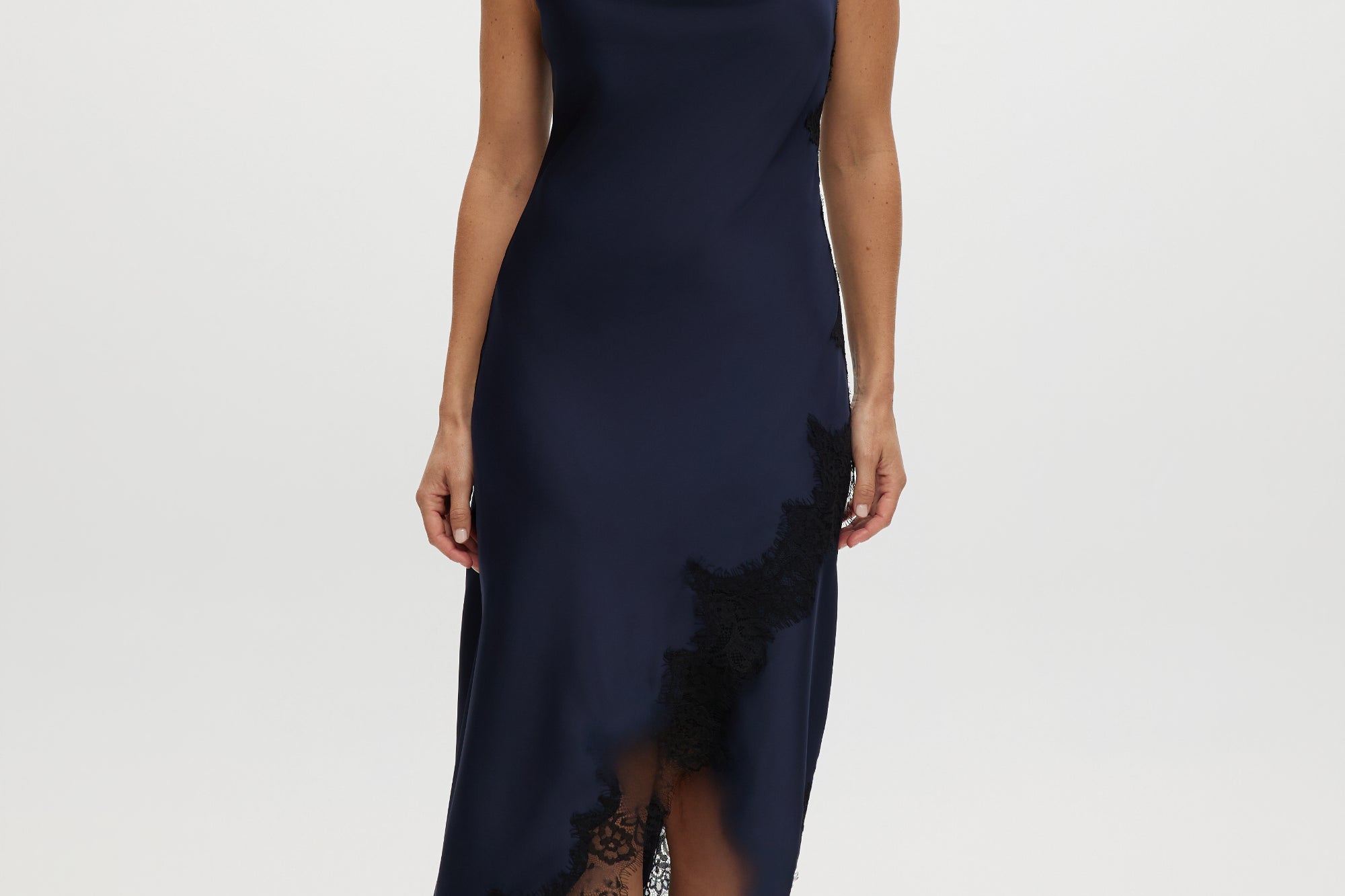 Navy satin cami dress with cowl neckline and lace trim.