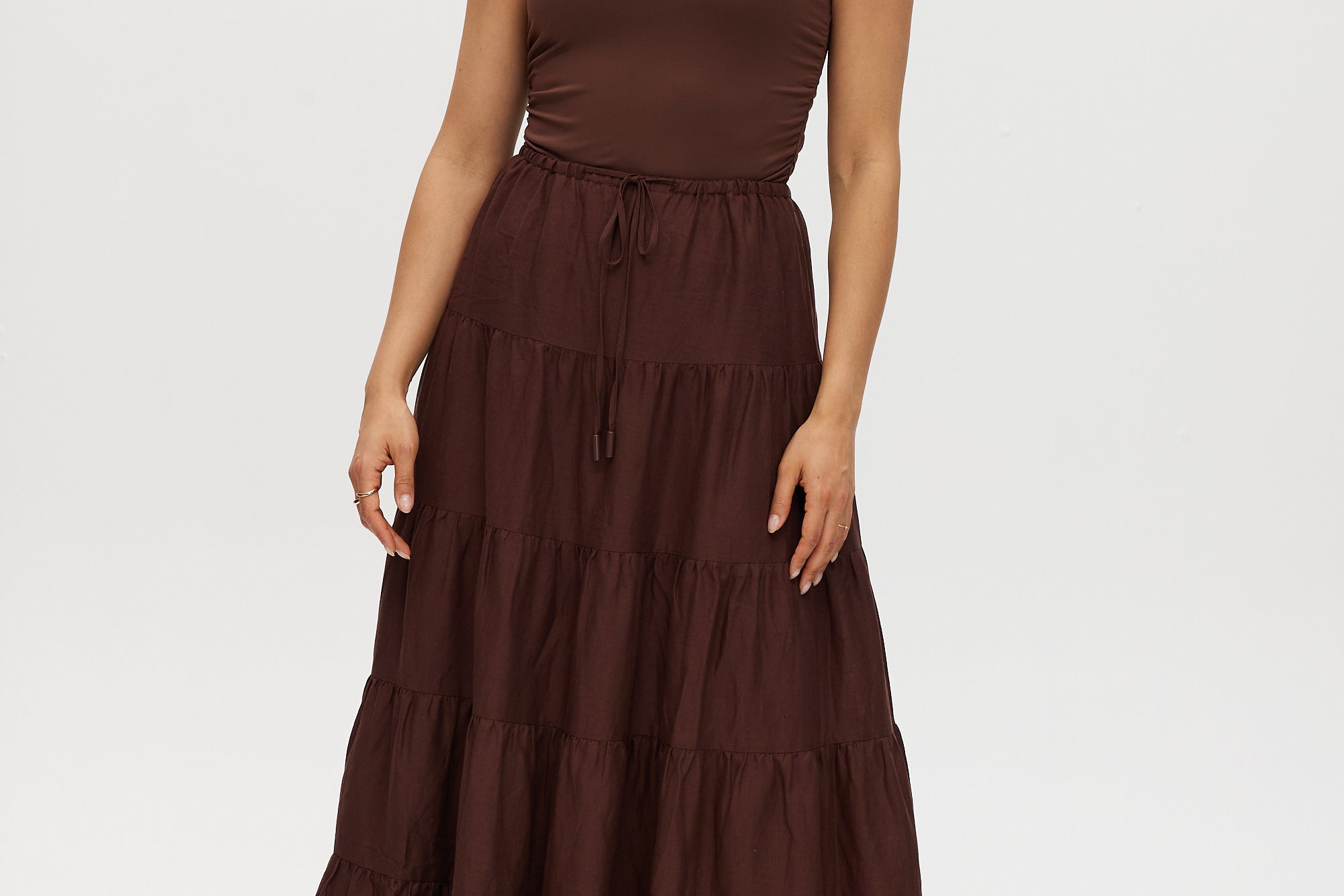Woman wearing a brown skirt  on a white background