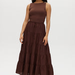 Woman wearing a brown skirt  on a white background