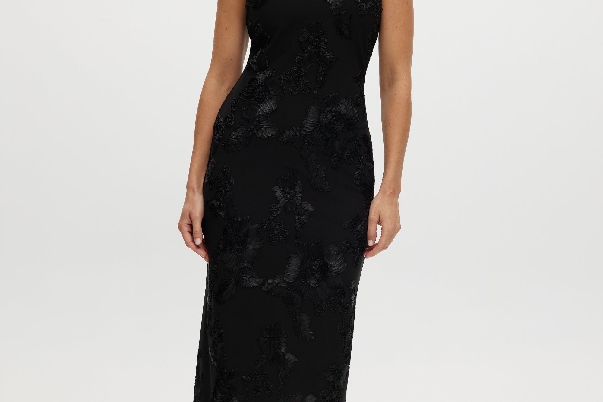 Black midi dress with floral embroidery, sleeveless and open-back design.
