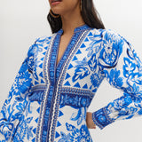 White and Blue Floral Linen Blend Midi Shirt Dress featuring a V-neckline, button front, crochet trim, and puff sleeves by Hilary Radley.