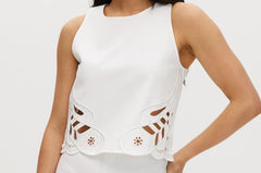 Off-White sleeveless top with embroidered cotton and button-back closure.