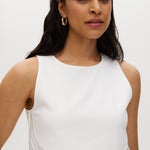 Off-White sleeveless top featuring embroidered cotton and button-back closure by Hilary Radley.