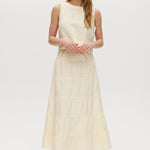 Yellow sleeveless cropped top featuring a crew neckline and tie-back detail by Hilary Radley.