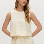 Yellow sleeveless cropped top with crew neckline and tie-back detail.