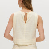 Yellow sleeveless cropped top featuring a crew neckline and tie-back detail by Hilary Radley.