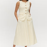 Light cream sleeveless top with button-front and waist tab detail by Hilary Radley.