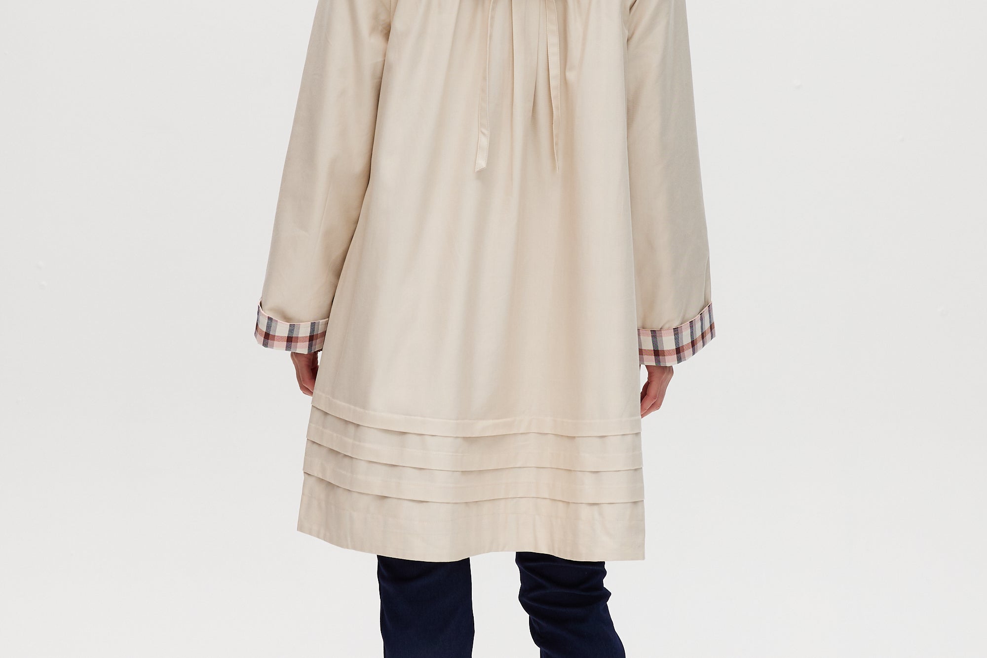 Cream Reversible Plaid & Solid Trench Jacket featuring a button-front closure and relaxed fit by Hilary Radley.