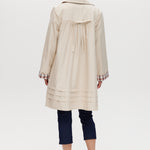 Cream Reversible Plaid & Solid Trench Jacket featuring a button-front closure and relaxed fit by Hilary Radley.