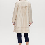 Cream Reversible Plaid & Solid Trench Jacket featuring a button-front closure and relaxed fit by Hilary Radley.