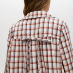 Cream Reversible Plaid & Solid Trench Jacket featuring a button-front closure and relaxed fit by Hilary Radley.