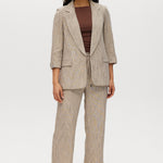 Beige striped yarn-dye linen blazer with 3/4 sleeves and lapel collar by Hilary Radley.