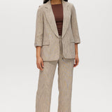 Beige striped yarn-dye linen blazer with 3/4 sleeves and lapel collar by Hilary Radley.