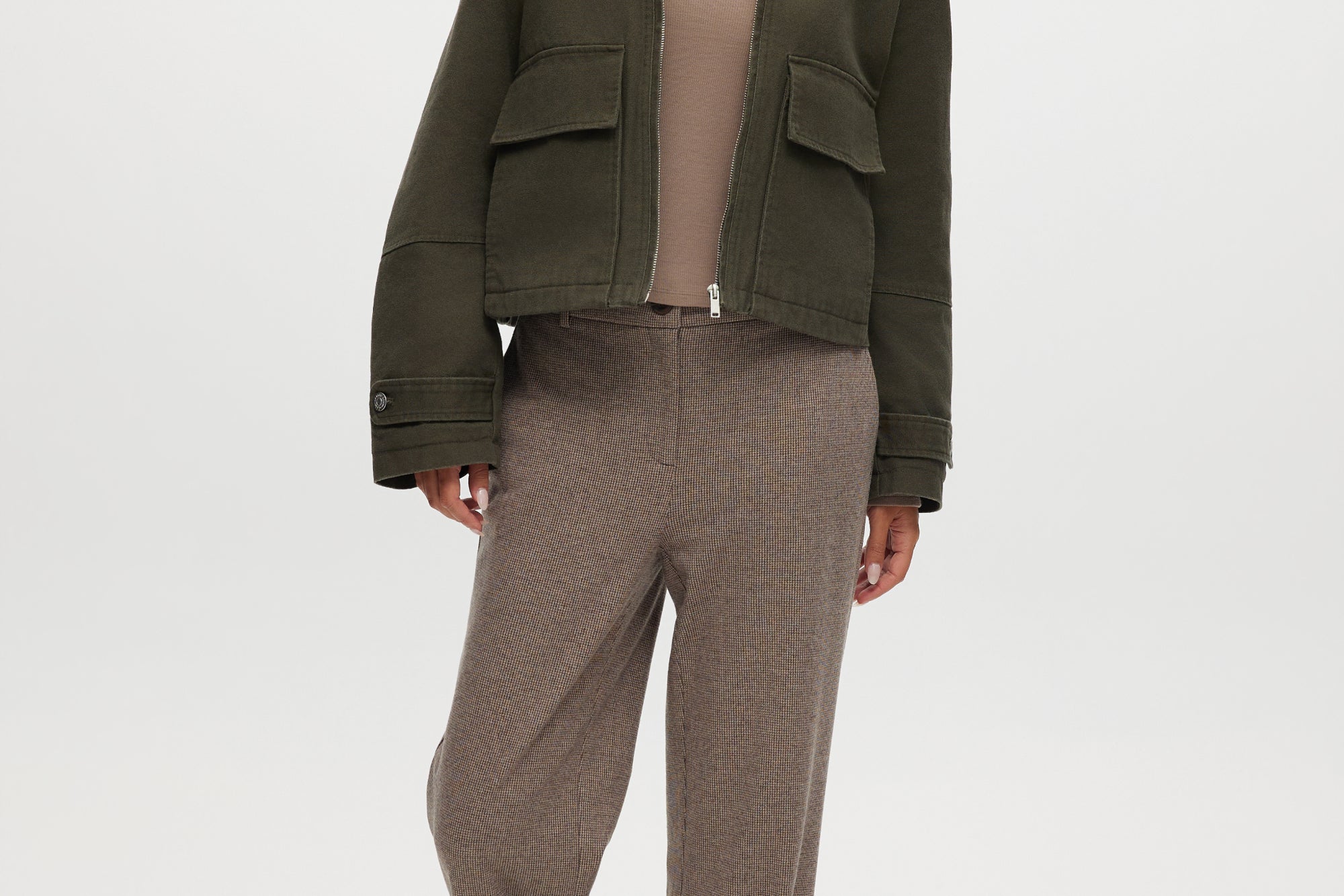 Olive green cotton canvas cropped jacket featuring a contrasting collar, zip-front, and patch pockets by Hilary Radley.