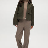 Olive green cotton canvas cropped jacket featuring a contrasting collar, zip-front, and patch pockets by Hilary Radley.