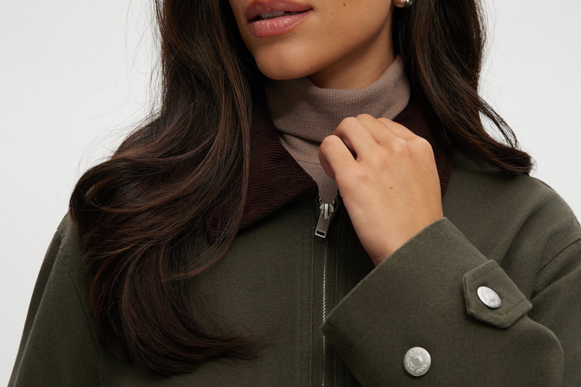 Olive green cotton canvas cropped jacket featuring a contrasting collar, zip-front, and patch pockets by Hilary Radley.