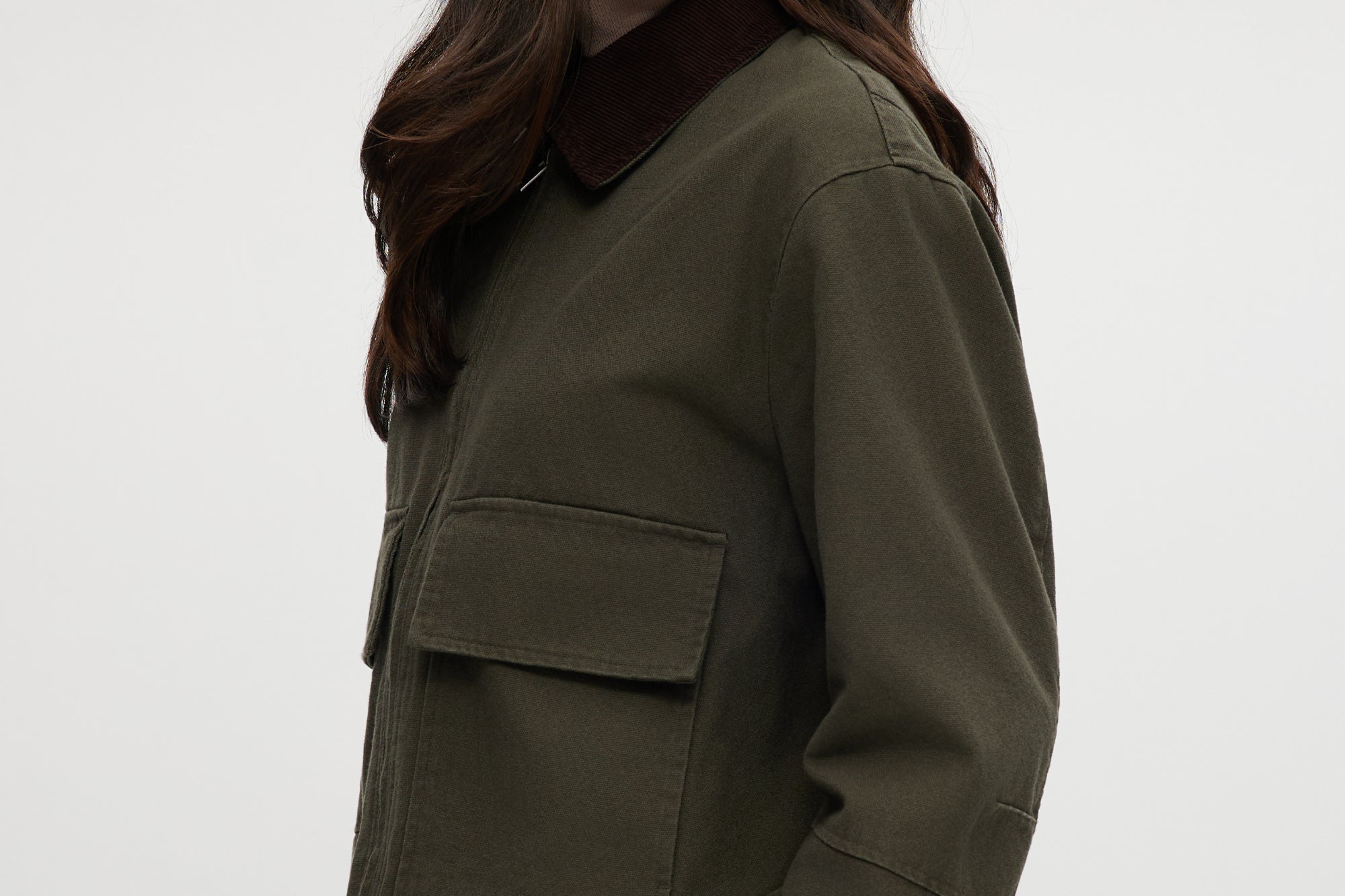 Olive green cotton canvas cropped jacket featuring a contrasting collar, zip-front, and patch pockets by Hilary Radley.